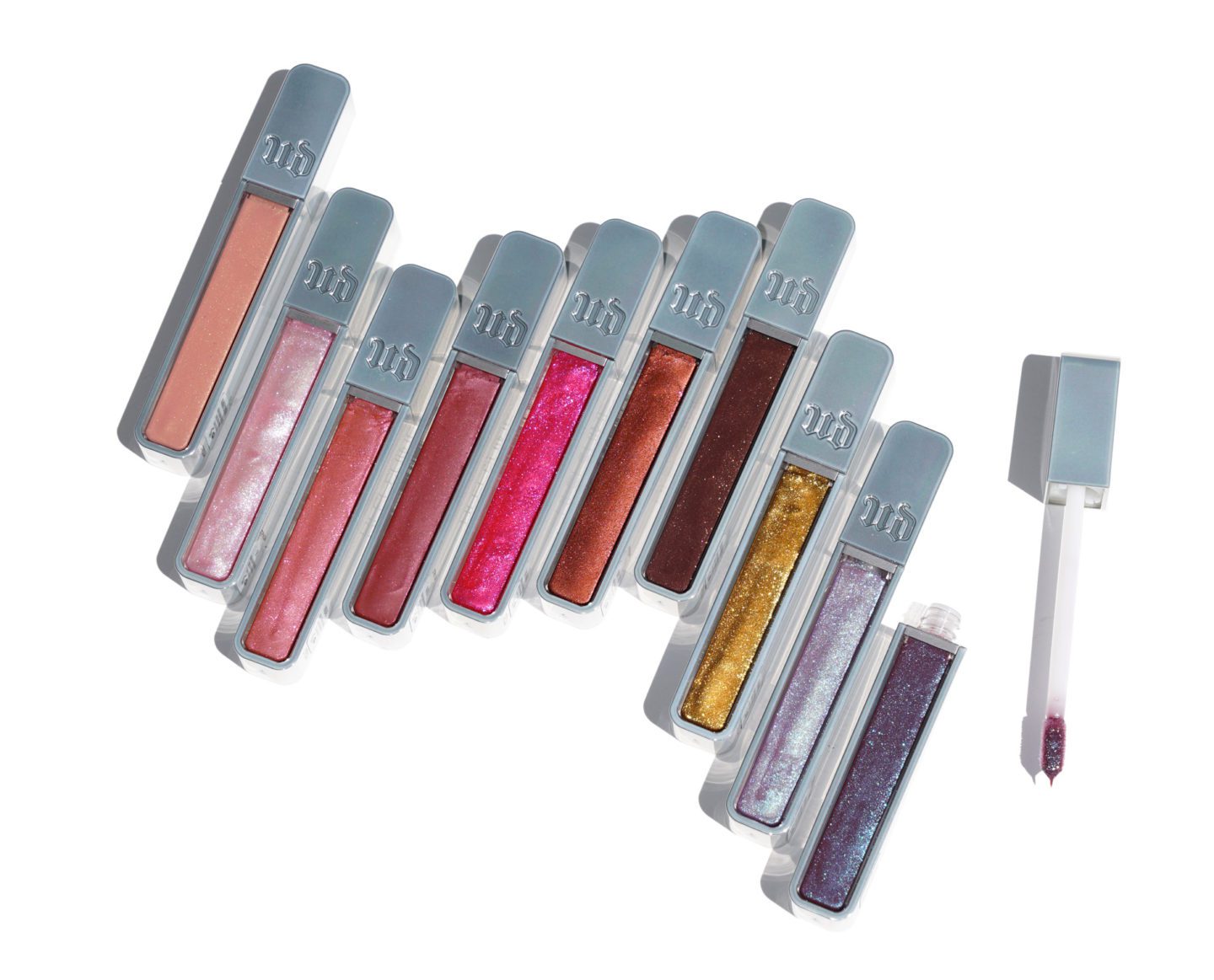 Urban Decay Hi-Fi Shine Lipgloss Below left to right: Midnight Cowgirl, SPL, Fireball, Naked, Big Bang, Dirty Talk, Shadow Heart, Goldmine, Candy Flip, Snapped