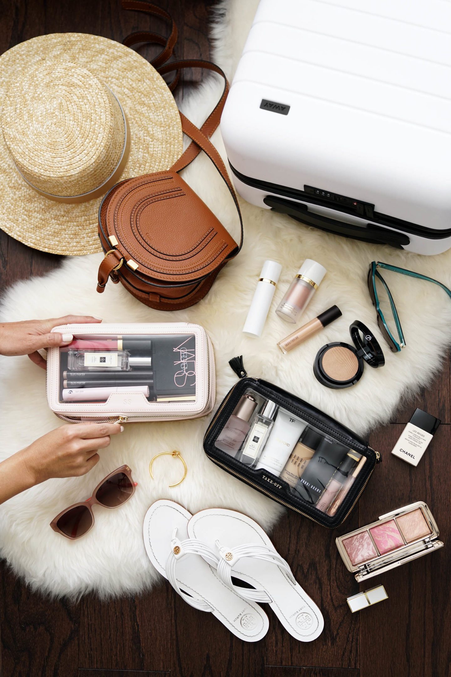 Packing Away Carry On via The Beauty Look Book