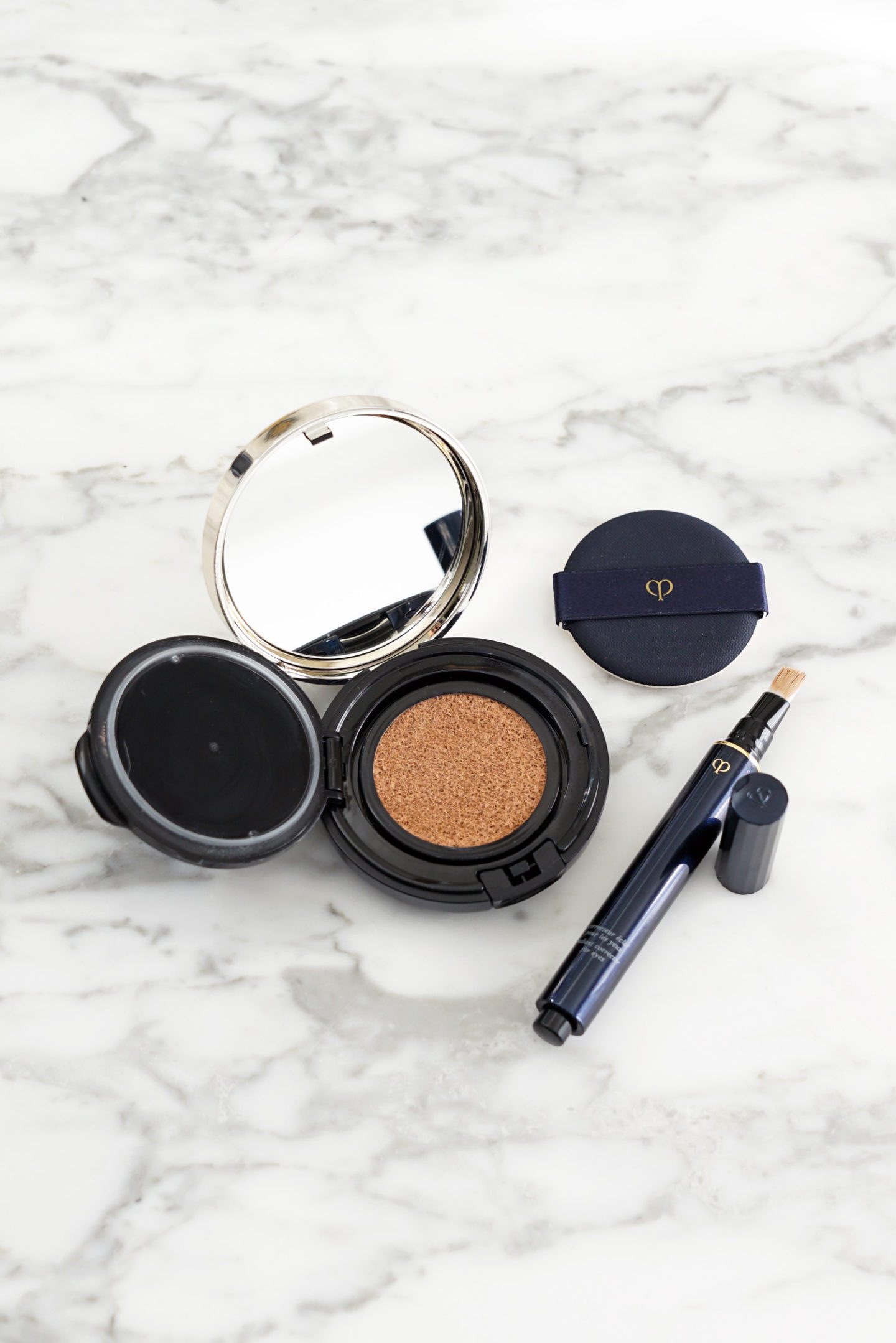 Cle de Peau Radiant Cushion Foundation in O30 and Corrector for Eyes in Ocher | The Beauty Look Book