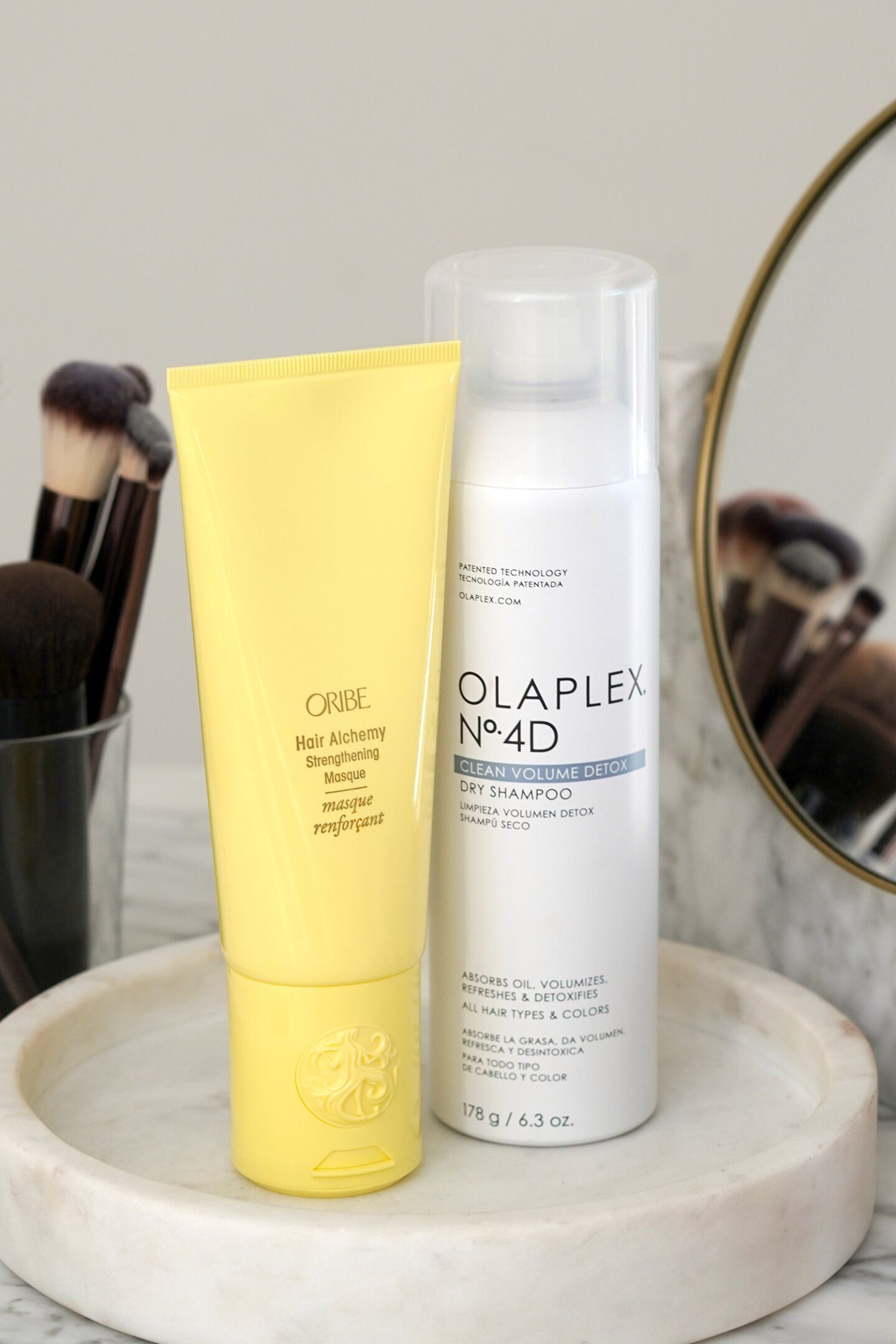 Oribe Hair Alchemy Strengthening Masque and Olaplex No.4D Clean Volume Detox Dry Shampoo 